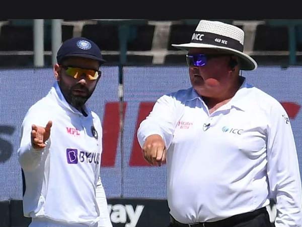 Kohli with umpire